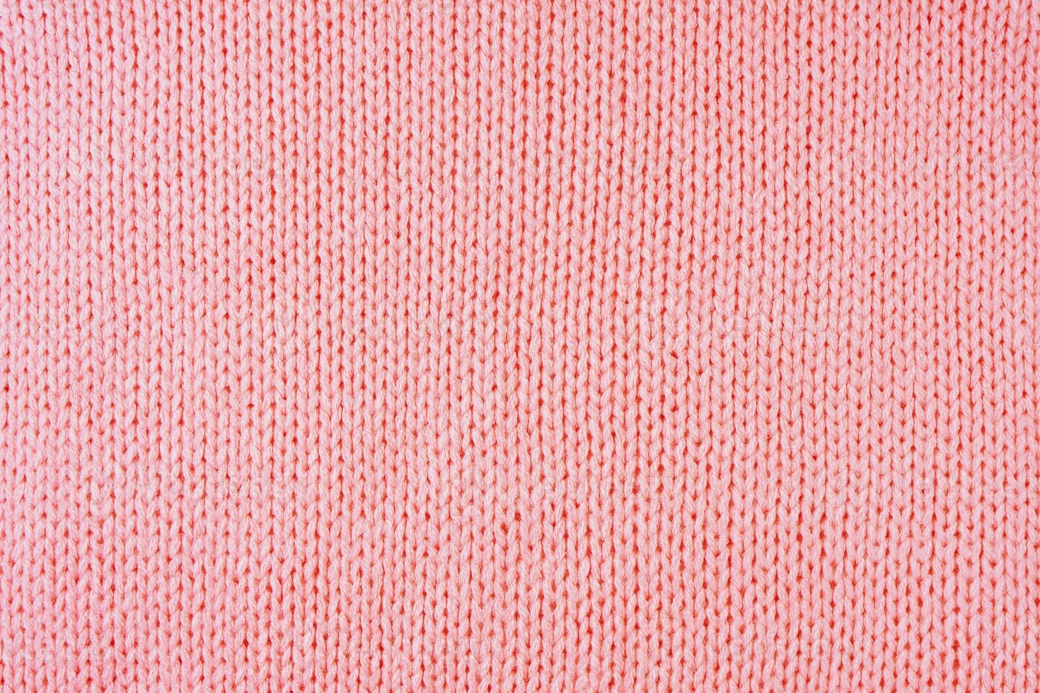 Fondo de textura de tela de lana de punto rojo brillante. telón de fondo textil abstracto foto