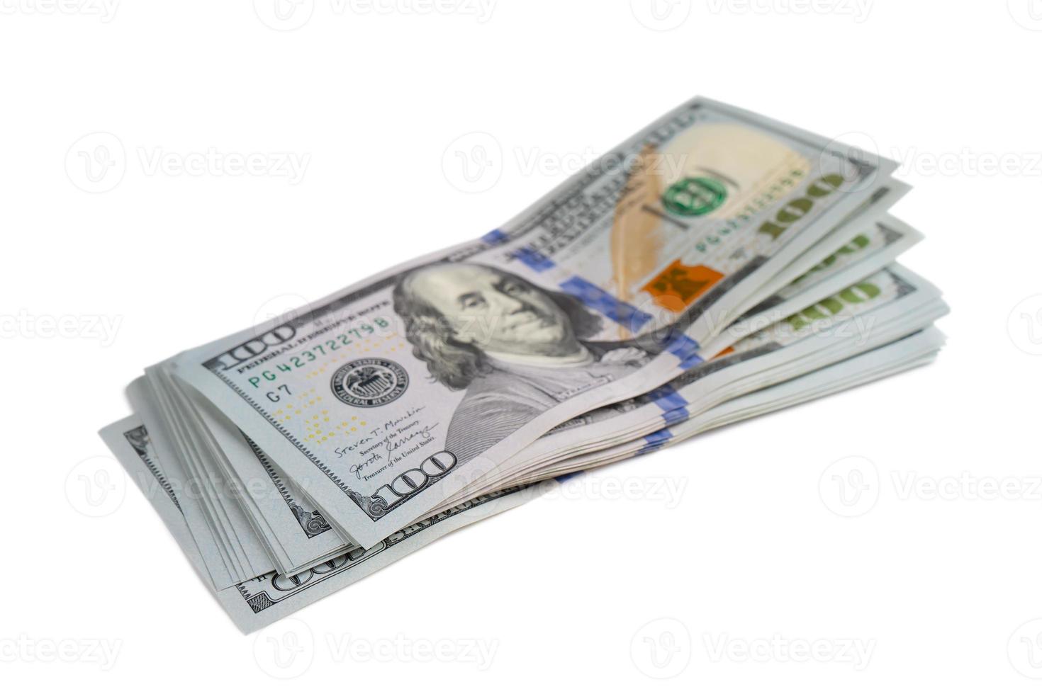 Pile of new design US dollar bills on white background photo