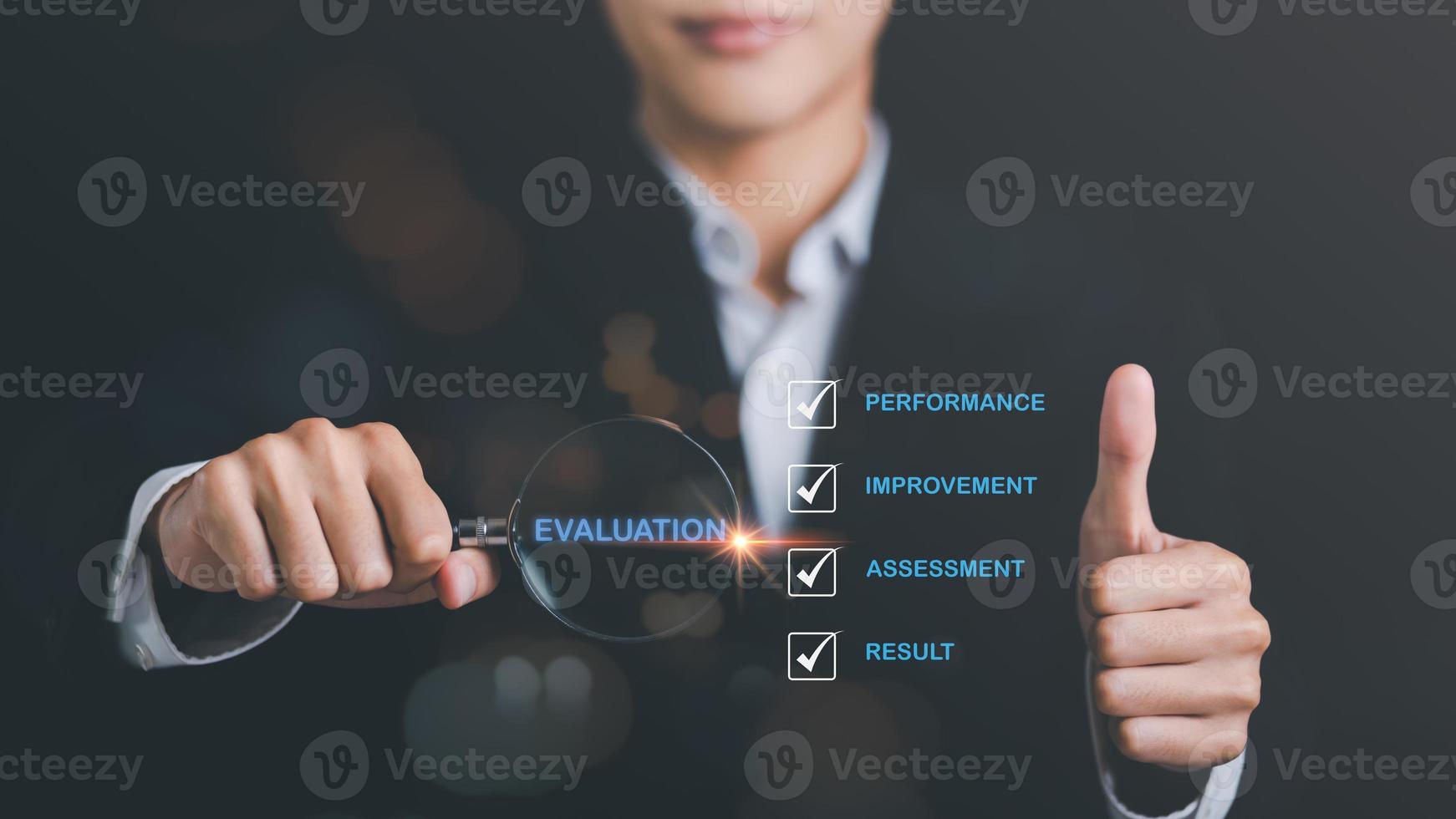 businessman holding a magnifying glass,result evaluation concept,plan review through professional analysis,review and rating to evaluate past performance,for the best performance and quality photo