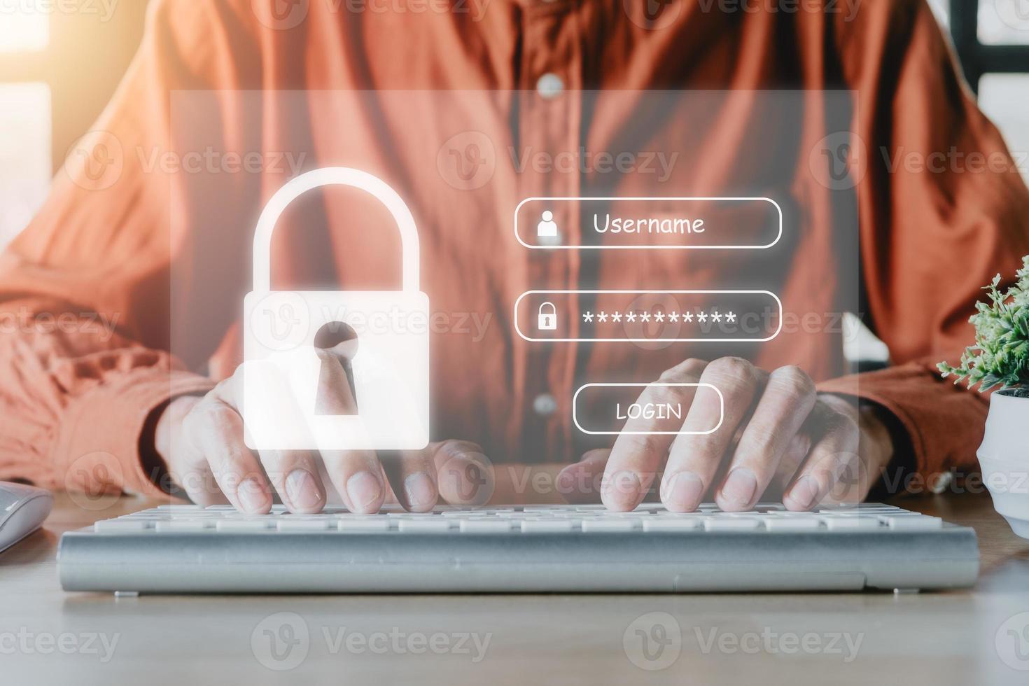 mano de hombre escribiendo en el teclado con inicio de sesión y contraseña en pantalla, concepto de seguridad cibernética, protección de datos y acceso seguro a Internet. foto