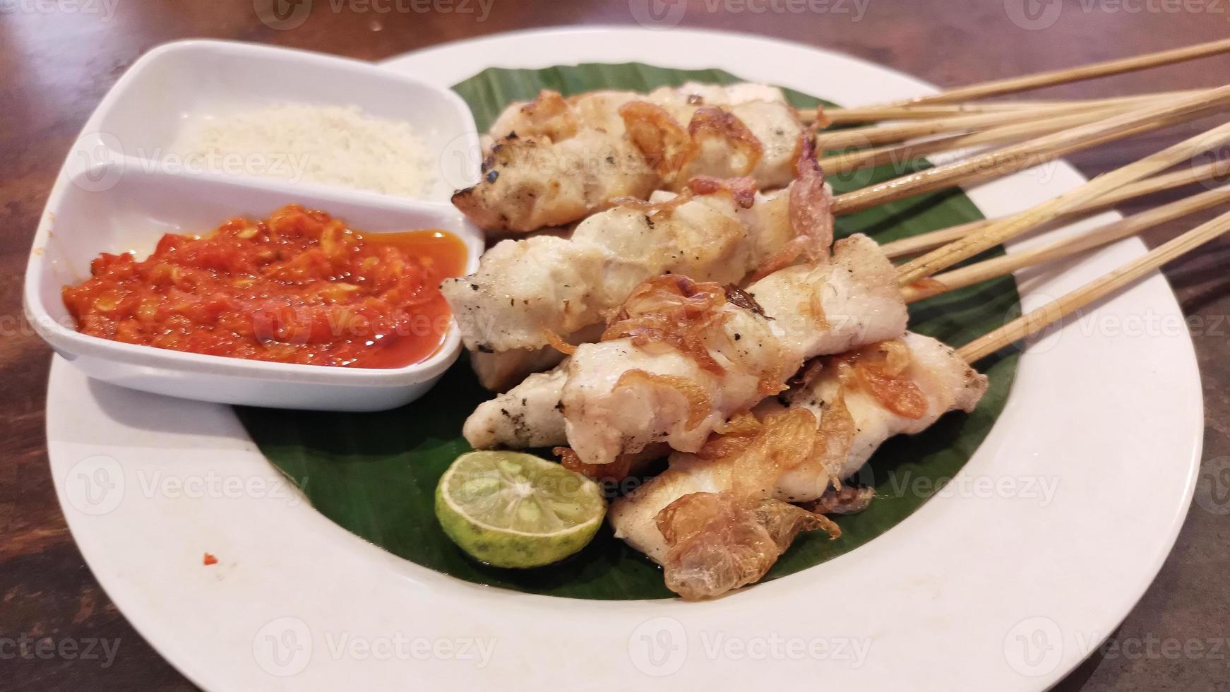 Chicken grilled satay skewers photo