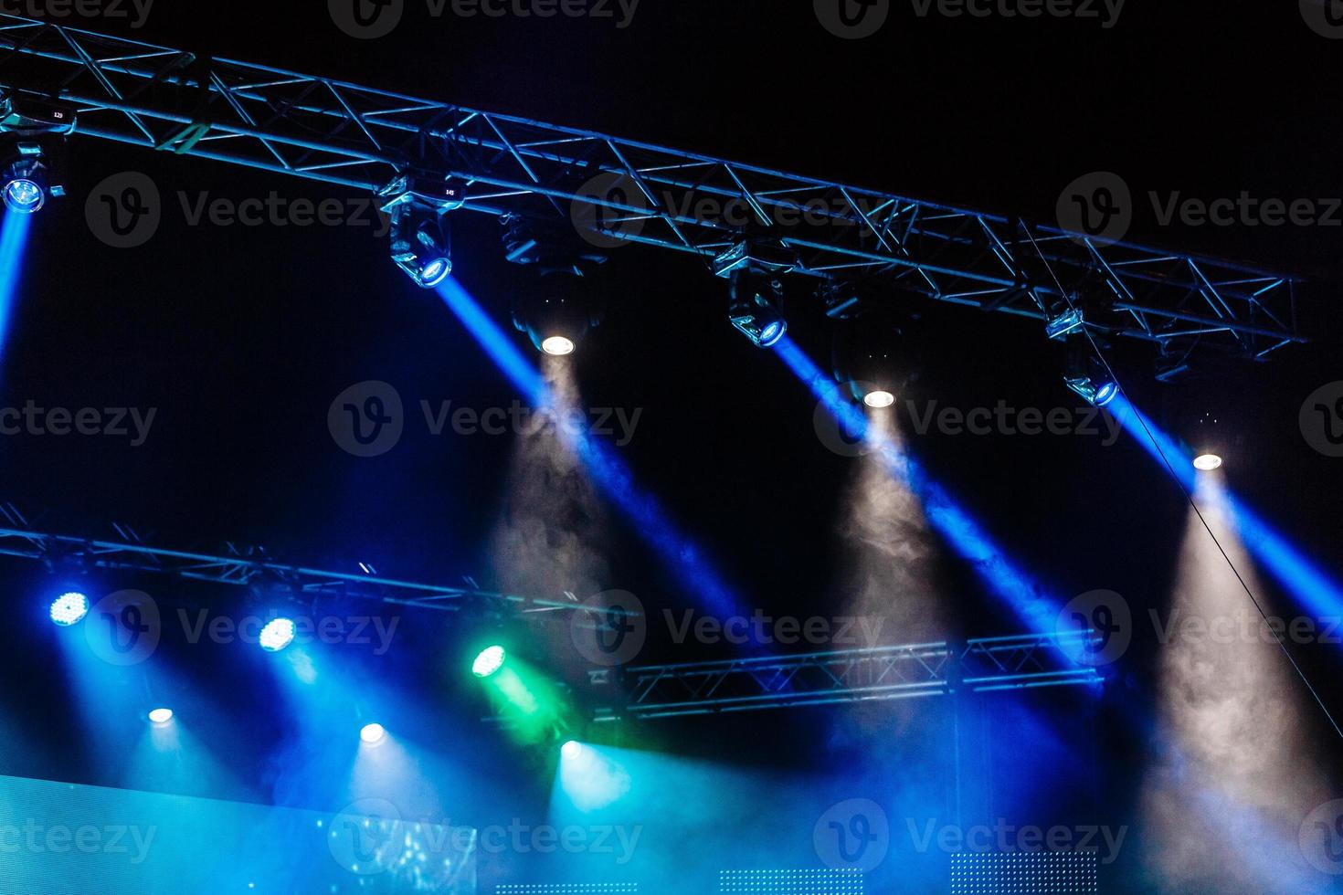 Illuminated empty concert stage with smoke photo