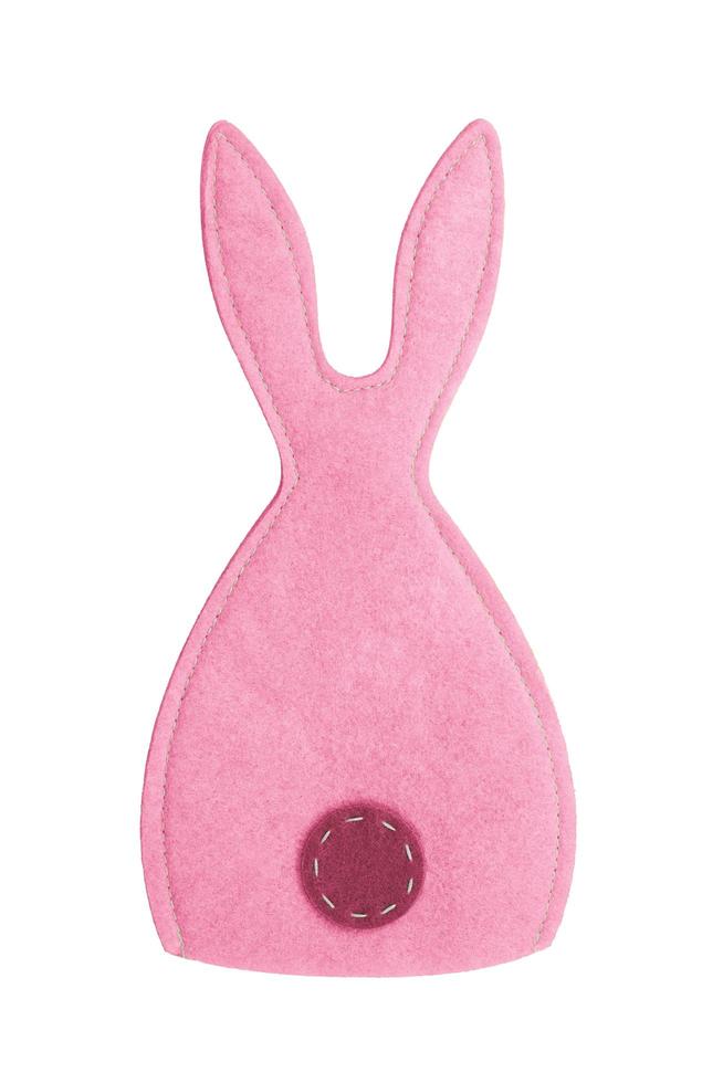 Pink felt stitched rabbit on white isolated background. Easter, symbol of year photo