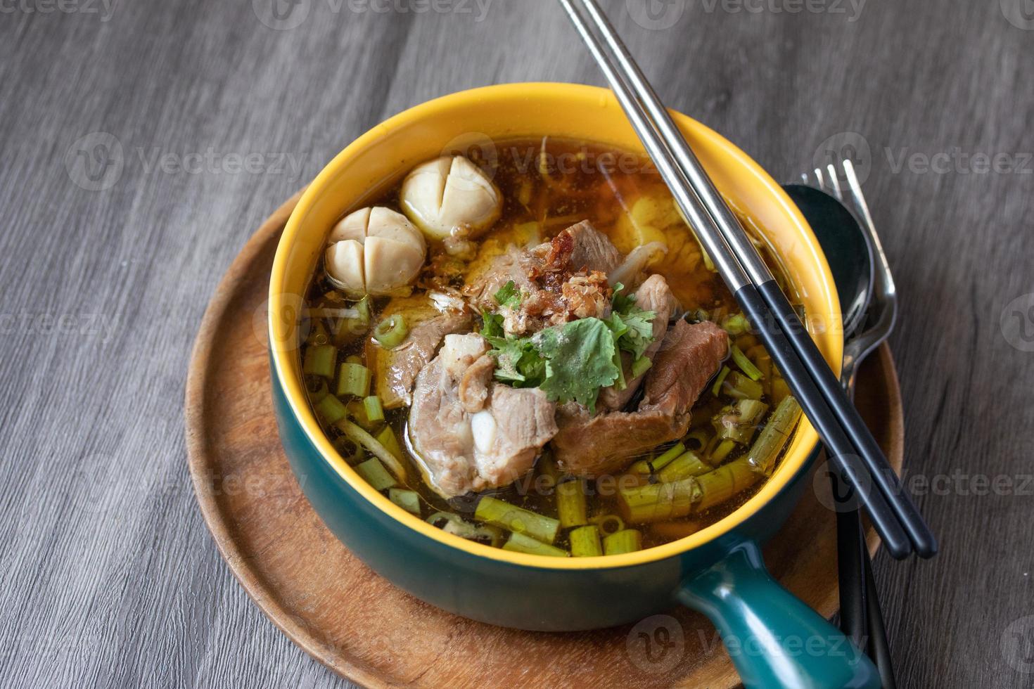 Braised pork kaolao with morning glory and sprouts, local Thai food photo