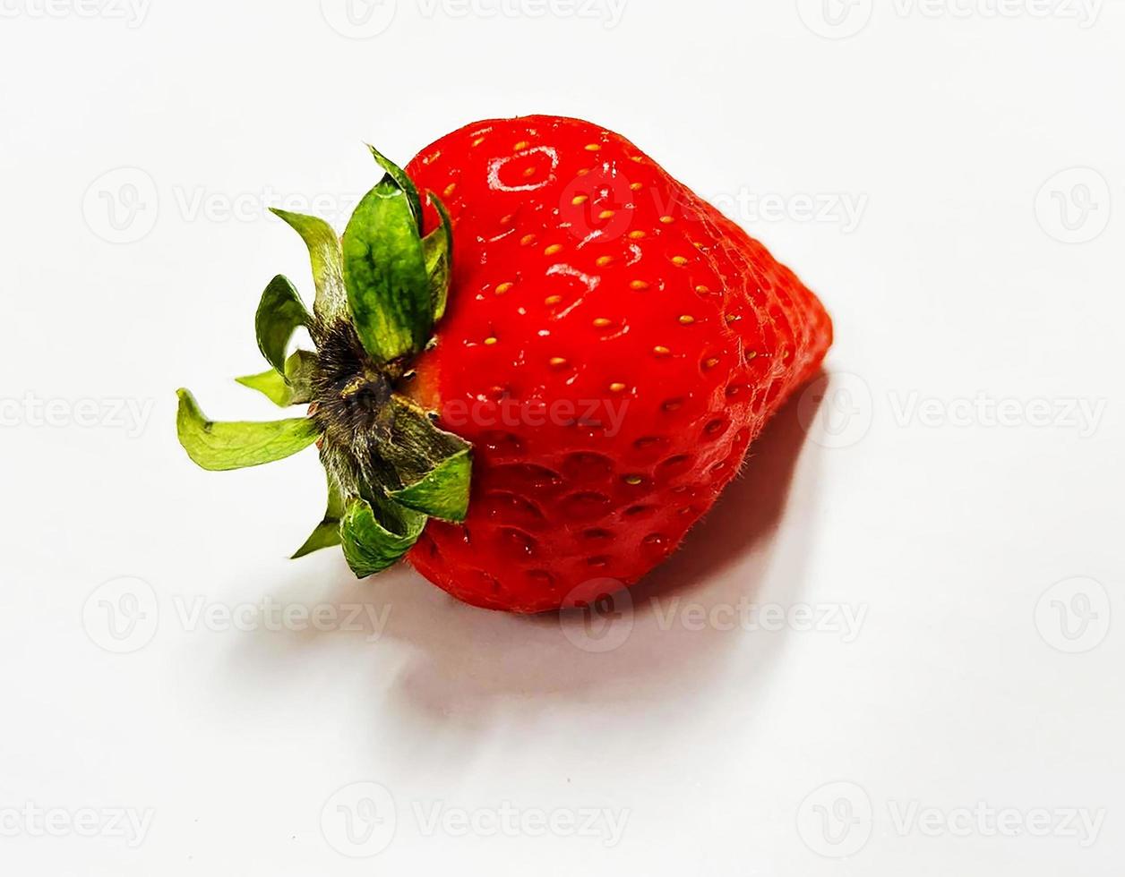 A strawberry on white background. photo