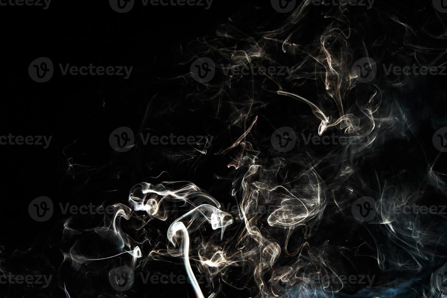 Smoke effect texture. Isolated background. Black and dark backdrop. Smokey fire and mistic effect. photo