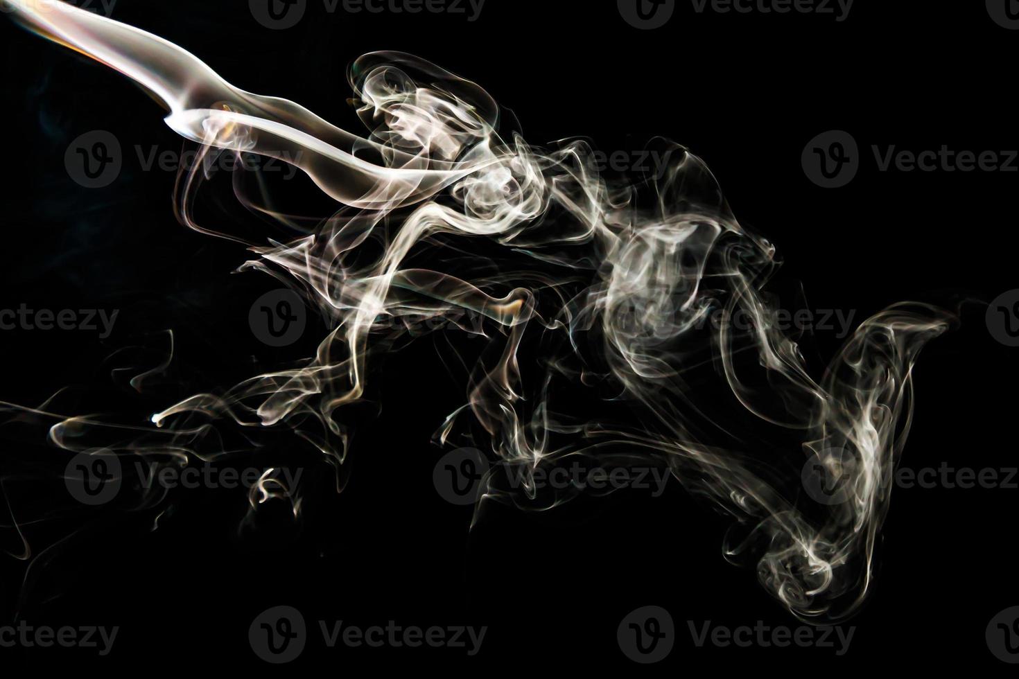 Smoke effect texture. Isolated background. Black and dark backdrop. Smokey fire and mistic effect. photo