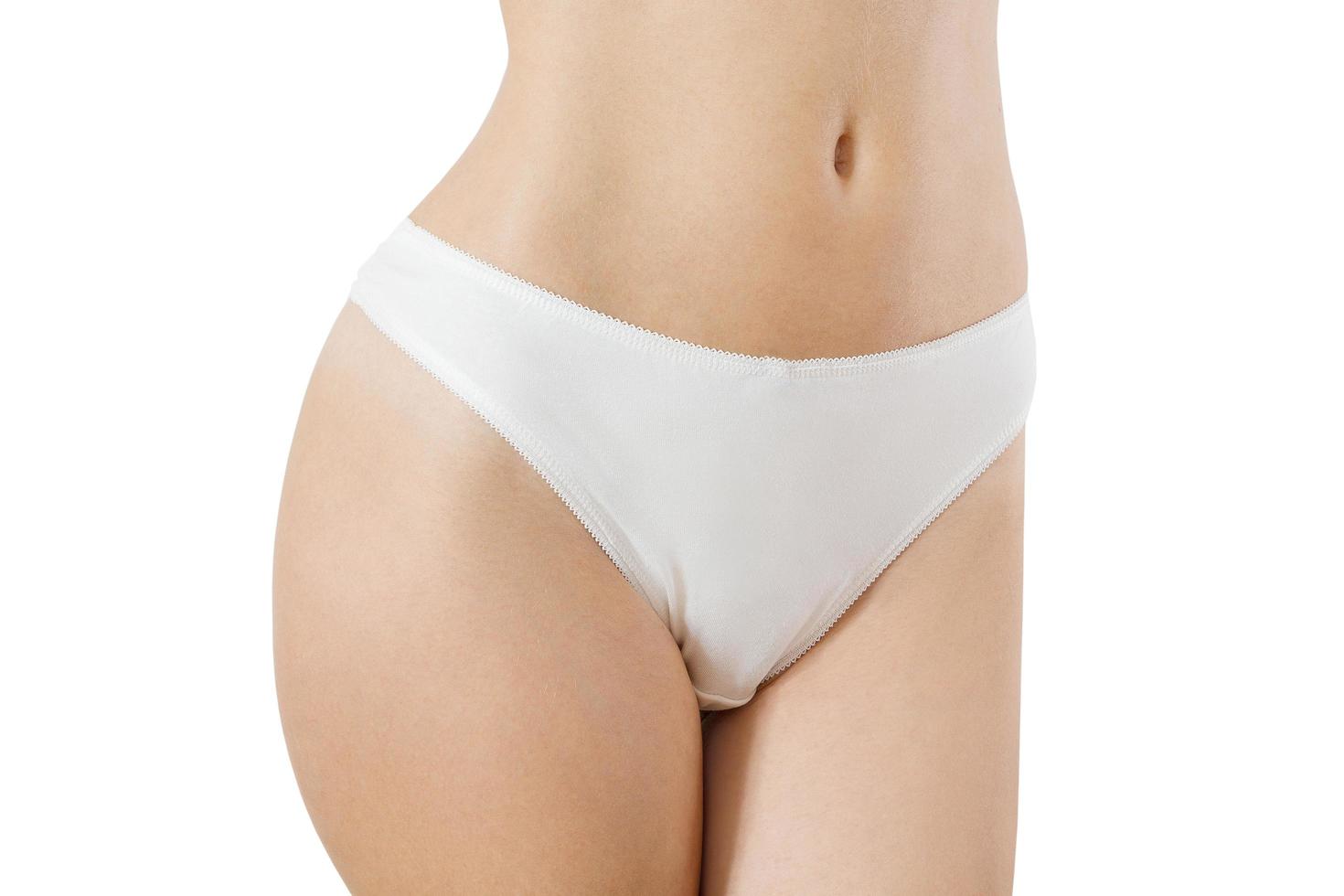 Blank Template White Women Panties Front view mock up. Woman flat belly and good nutrition. Bikini anderwear with shave line and perfect skin. Cropped image. Body care and healthcare. Spa, copy space photo