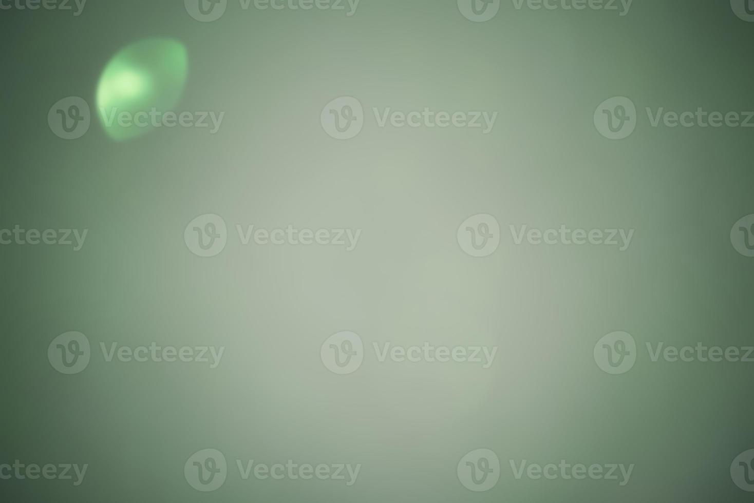 Green defocus background with vignette. Defocus light green. photo