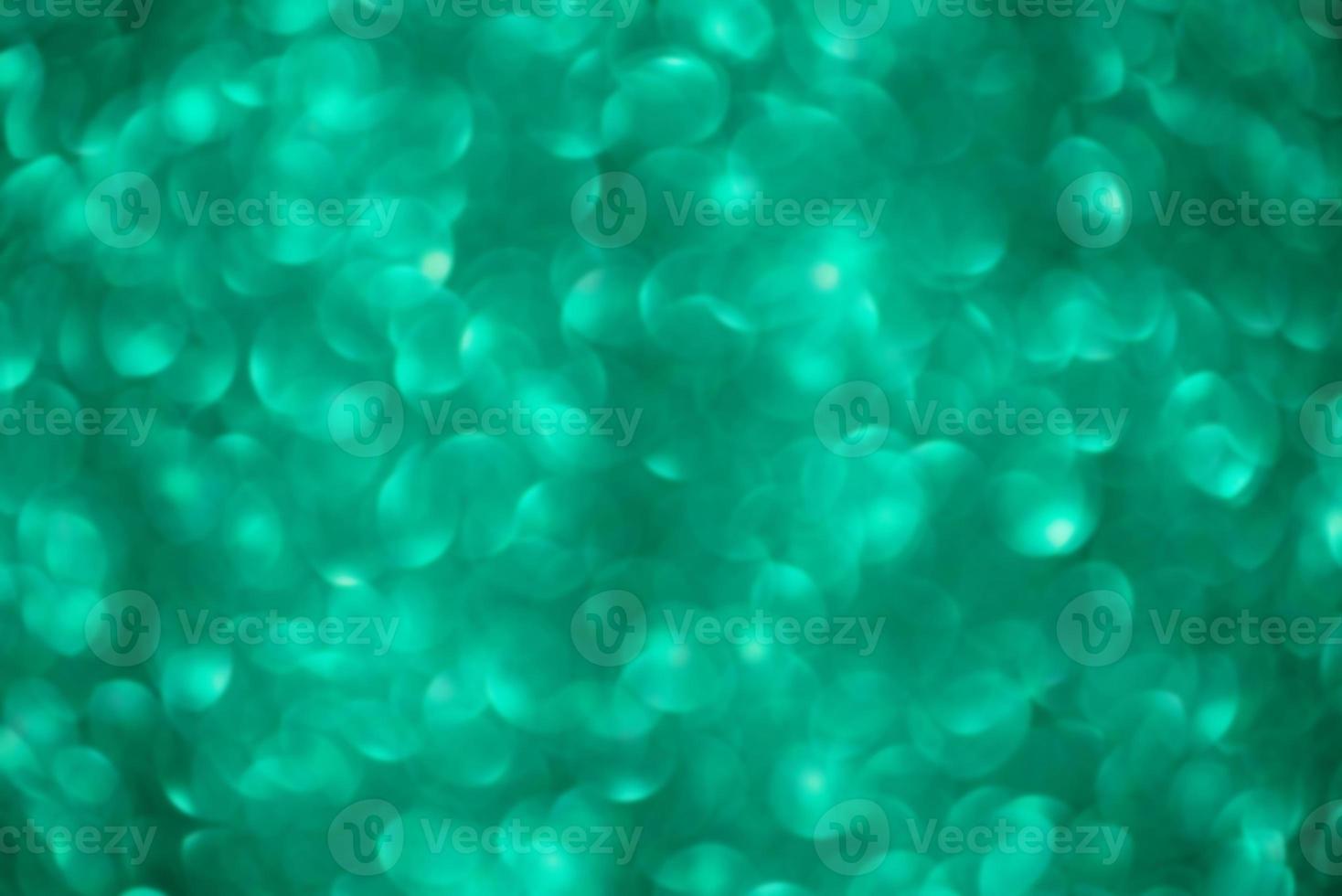 Green glitter defocus background. Abstract defocus light background. photo
