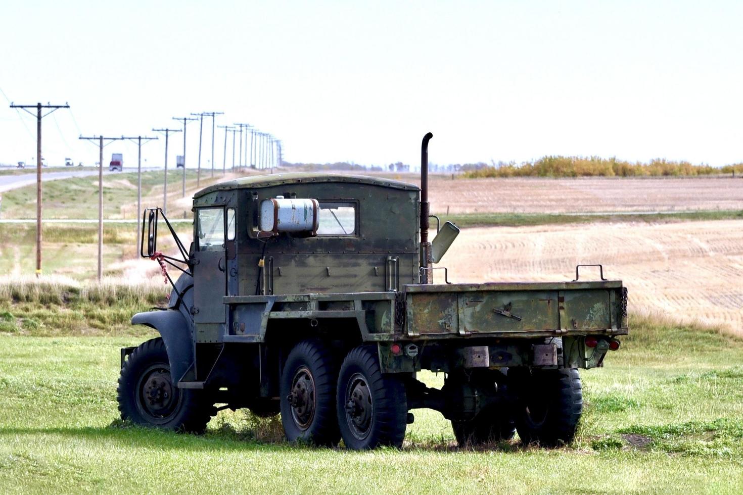 old surplus military truck om a farm photo