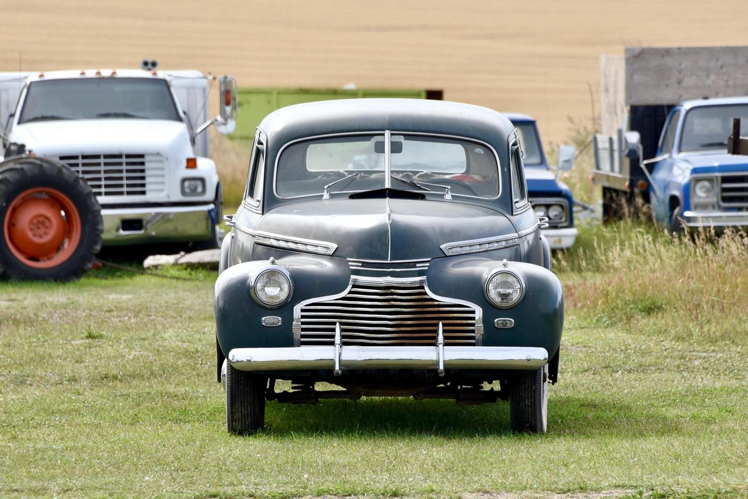 classic car in a field photo