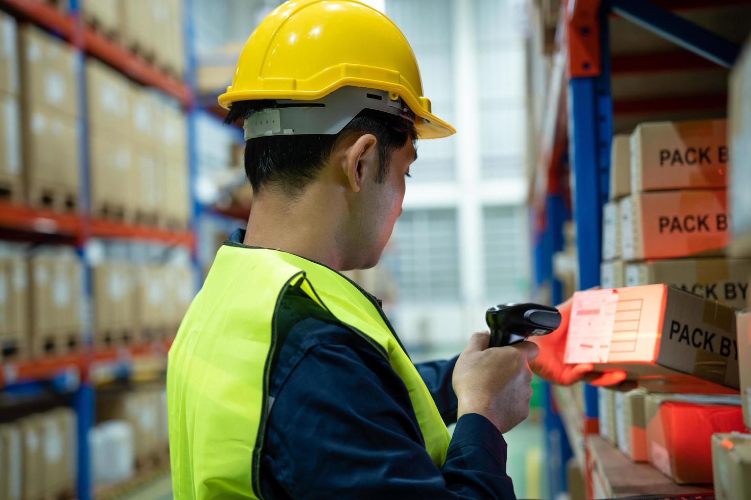 Warehouse worker pull pallet truck after inspects goods in inventory and check stock product. Transport logistic business shipping and delivery to customers through a freight forwarding company. photo