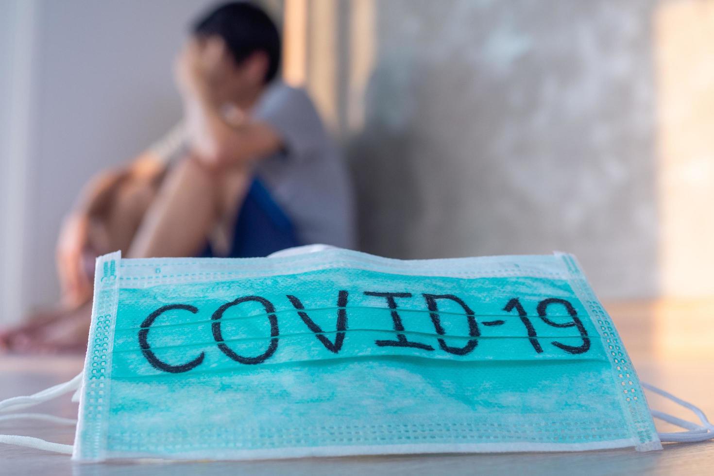 Mask writes Covid-19, the virus infection situation 2019-nCoV spread around the world Deadly disaster of the world. Men afraid of getting infected with the virus and psychosis on backgroud photo