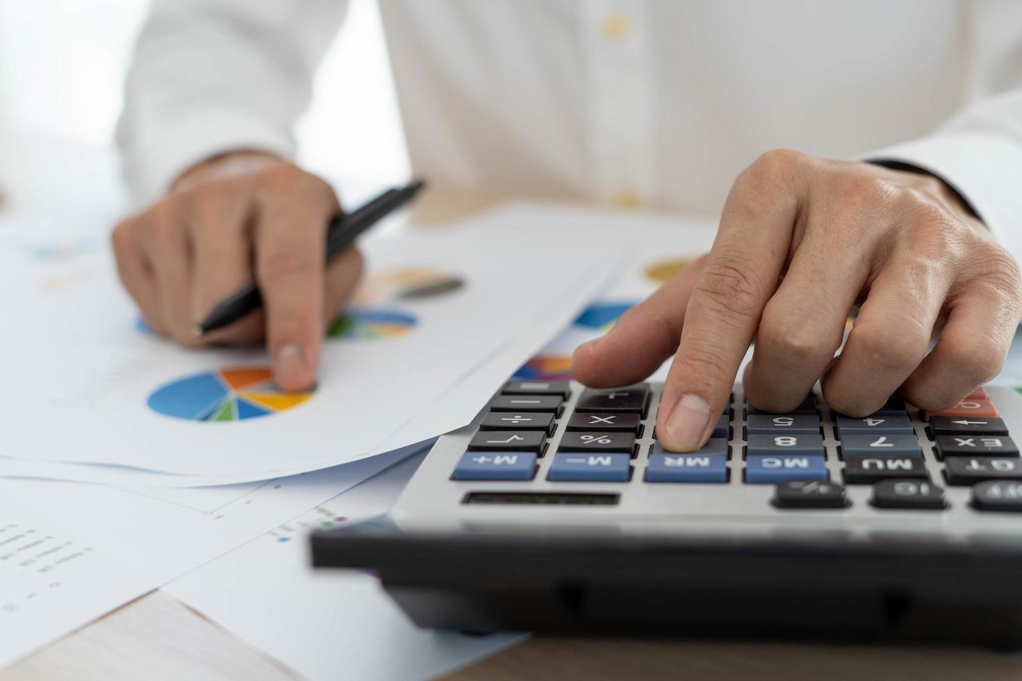 Business men looking at charts, spreadsheets, graph financial development, bank accounts, statistics, economy, data analysis, investment analysis, stock exchange photo