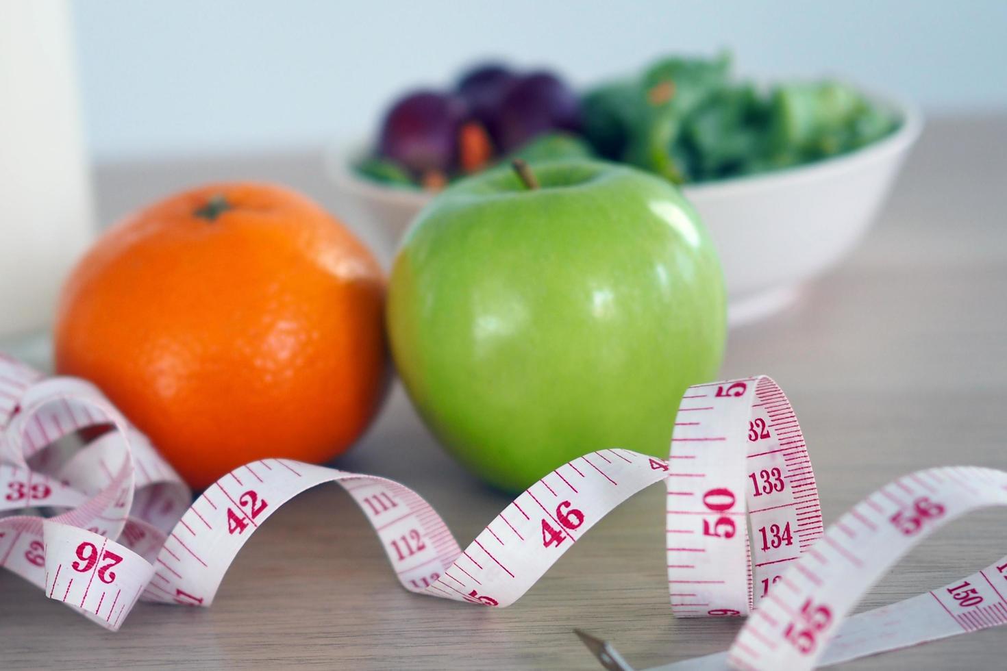 Salad of vegetables, oranges and apples for good health photo