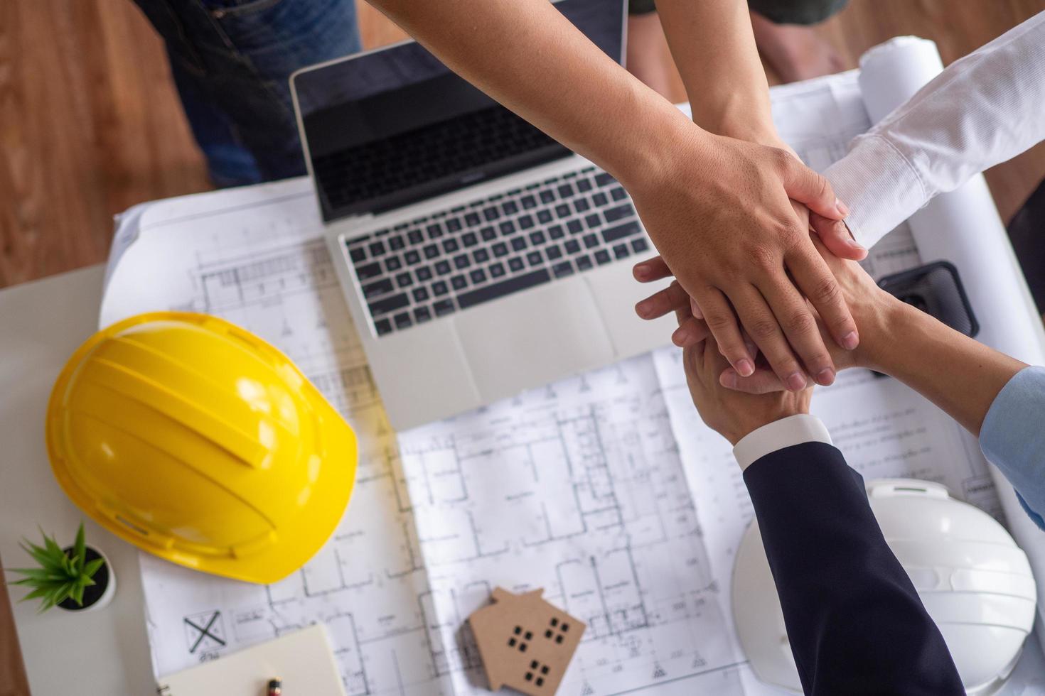 Working together as a team, brainstorming, editing, and proposing various methods for successful work between a team of contractors, engineers, and architects. photo