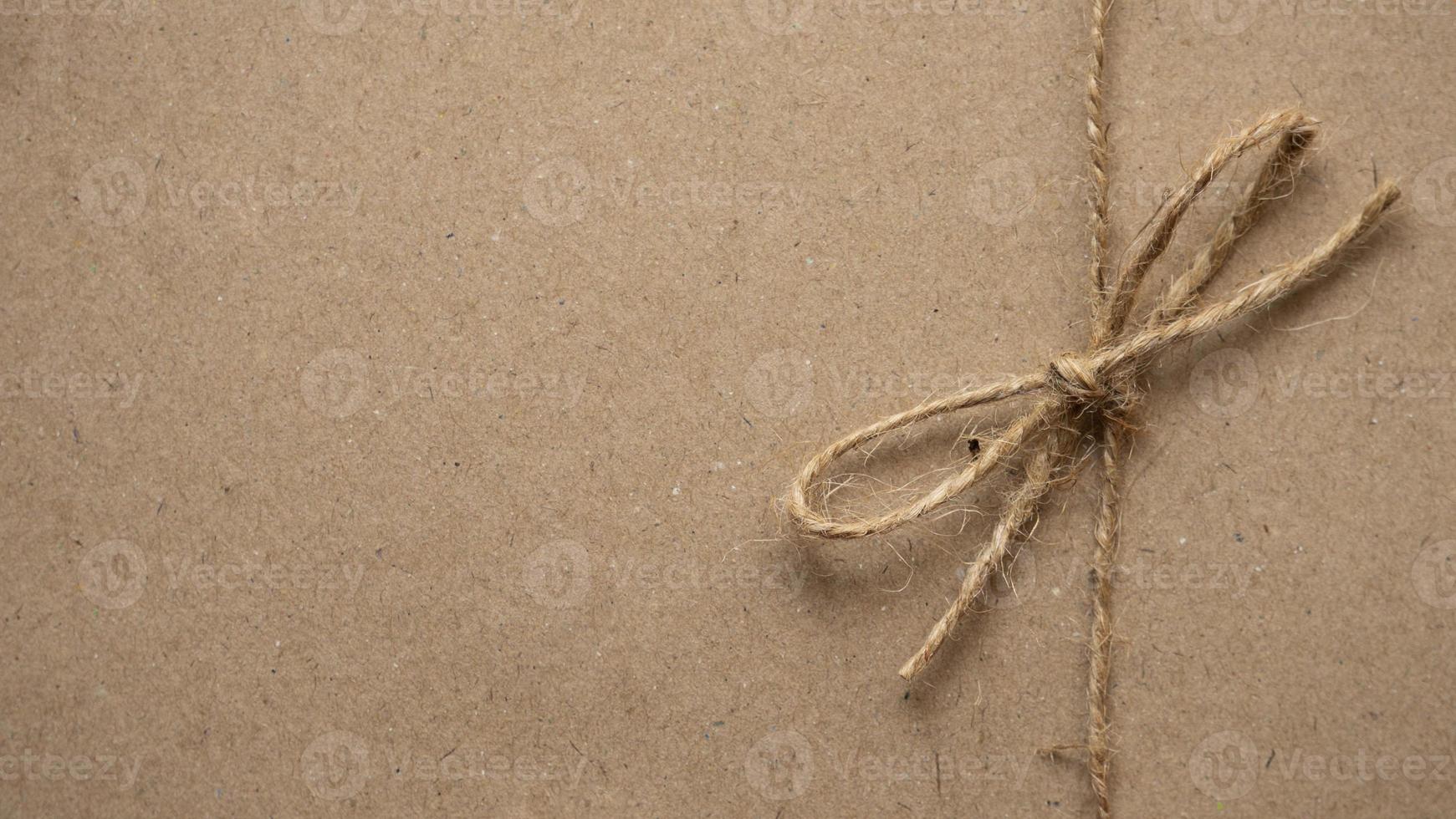 Rustic bow to wrap brown gift boxes. Vintage background and copy space photo