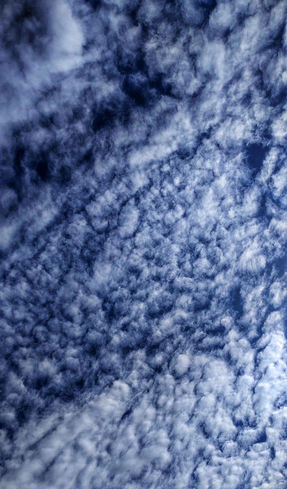 Beautiful portrait background blue sky and wispy clouds photo