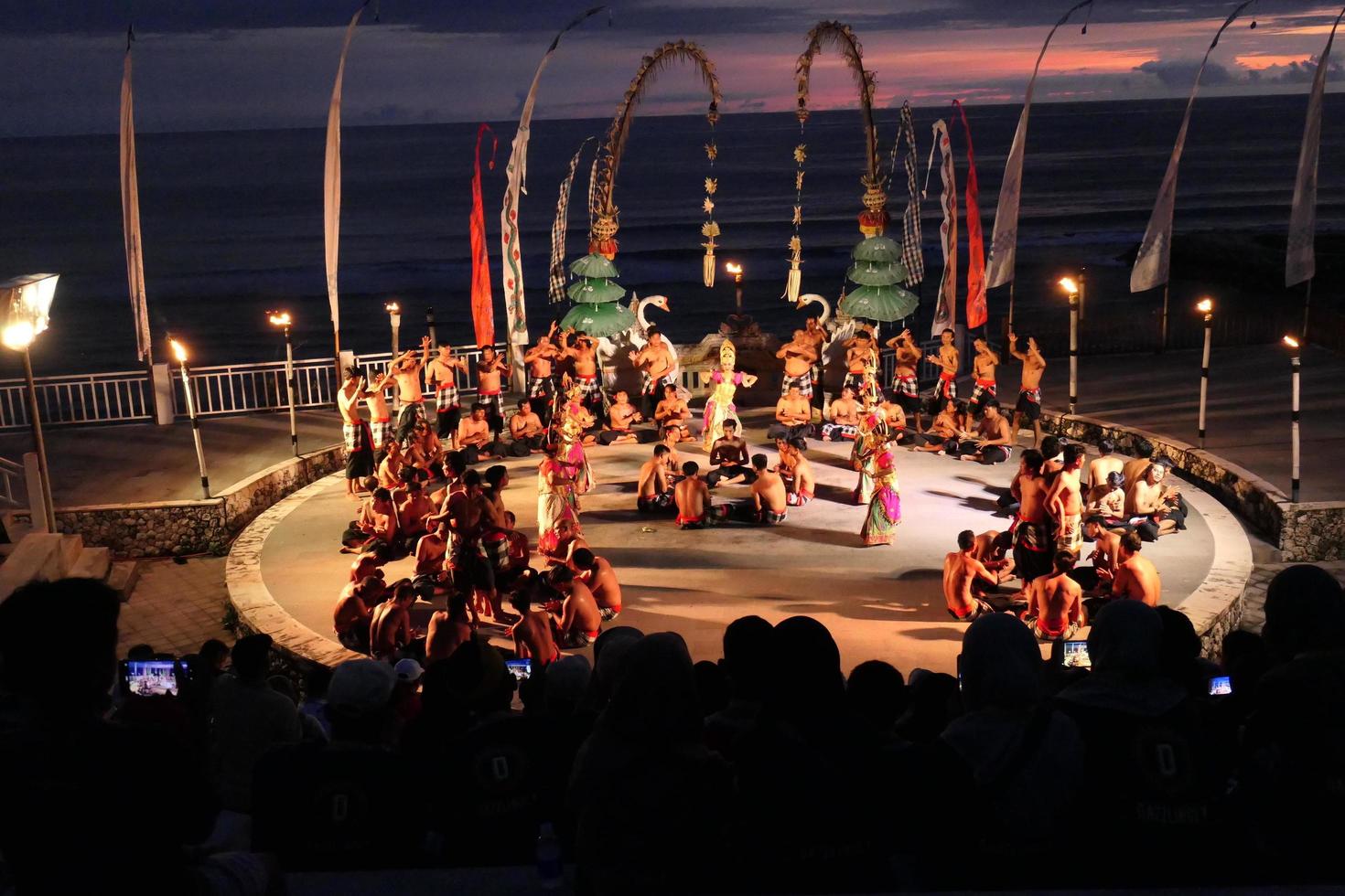 Kecak dance performance on Melasti Beach, bali, Indonesia photo