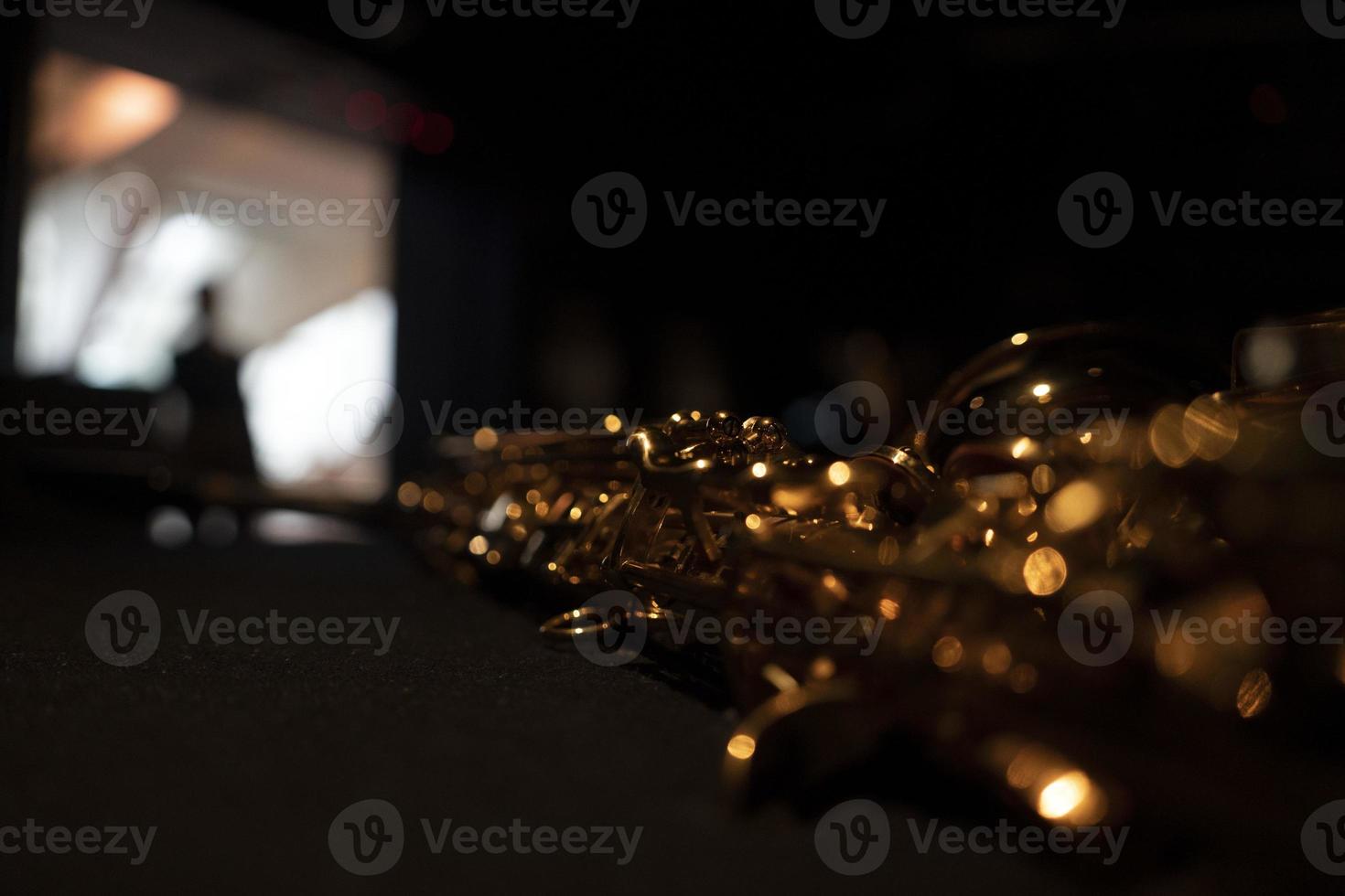 saxophone detail close up isolated on black photo