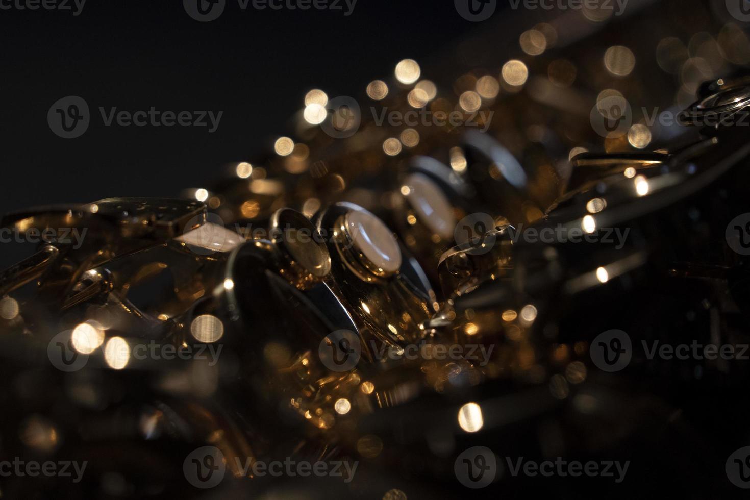 saxophone detail close up isolated on black photo