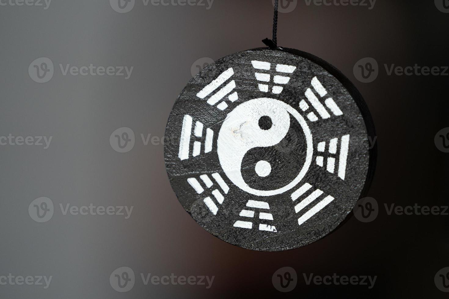 Yin Yang symbol pendant isolated photo