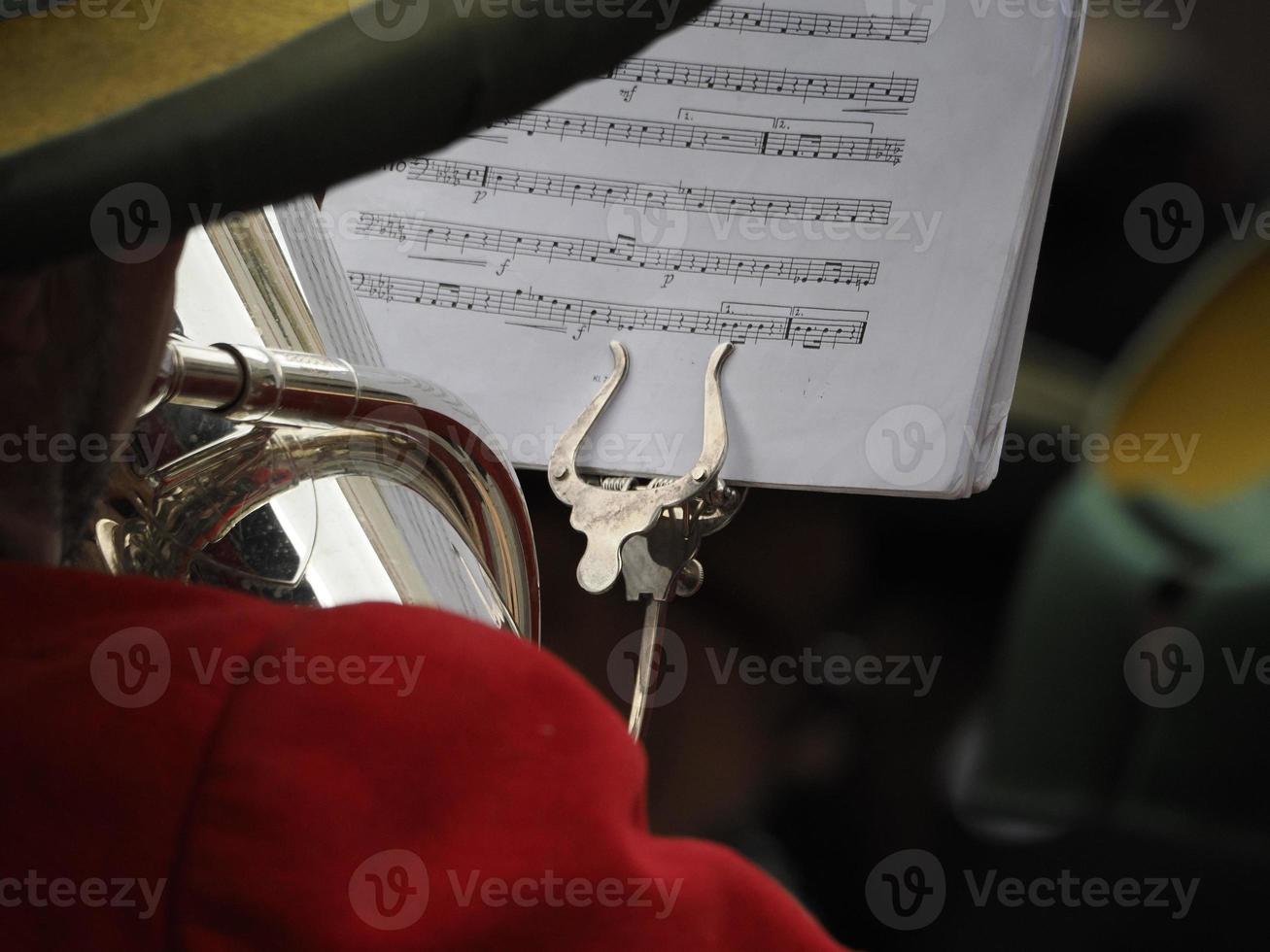 hands playing bass tuba detail photo