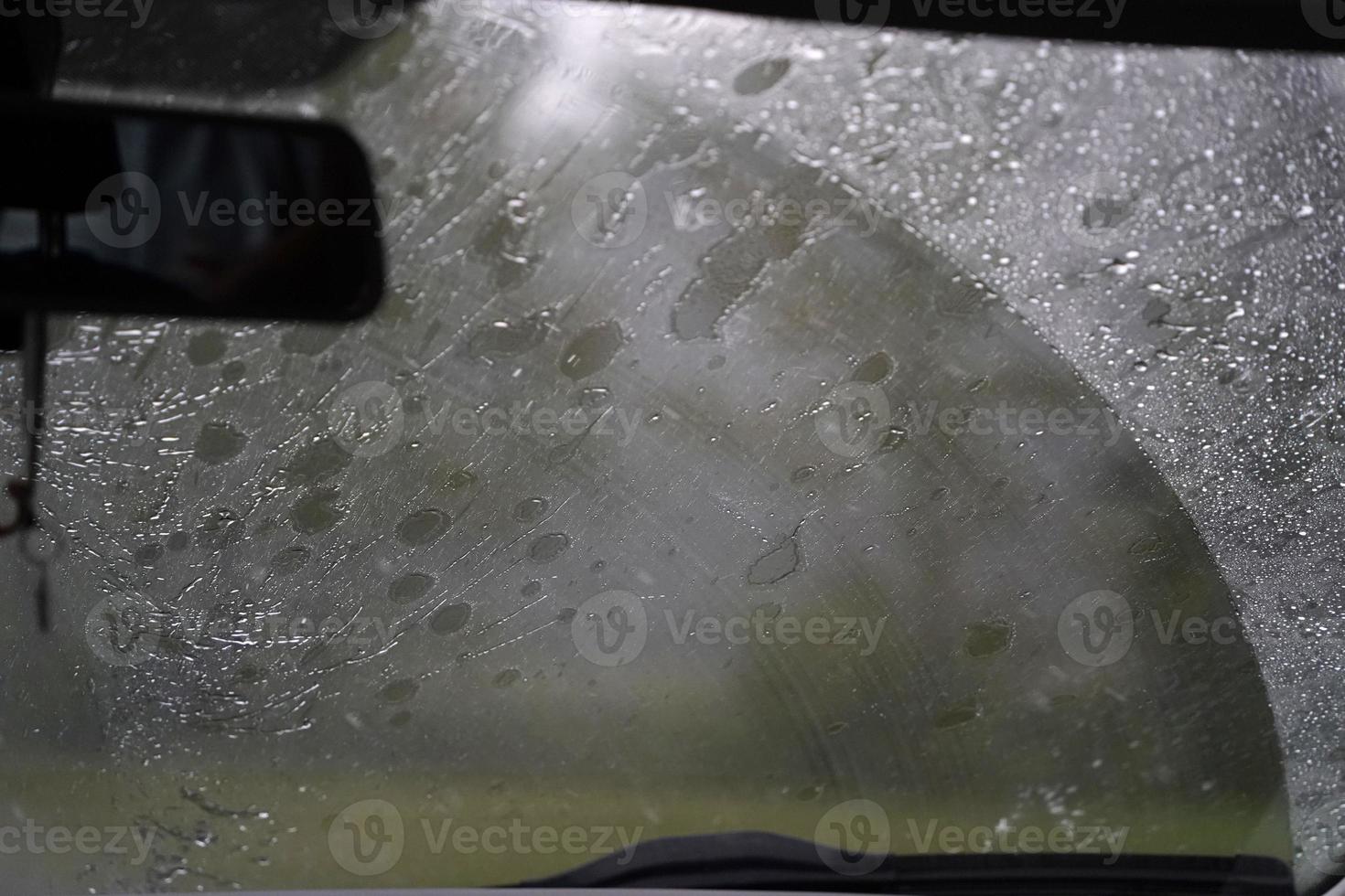 heavy rain on car windscreen wiper photo