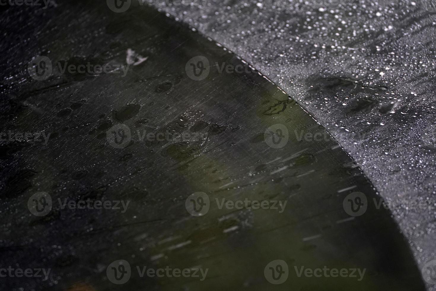 heavy rain on car windscreen wiper photo