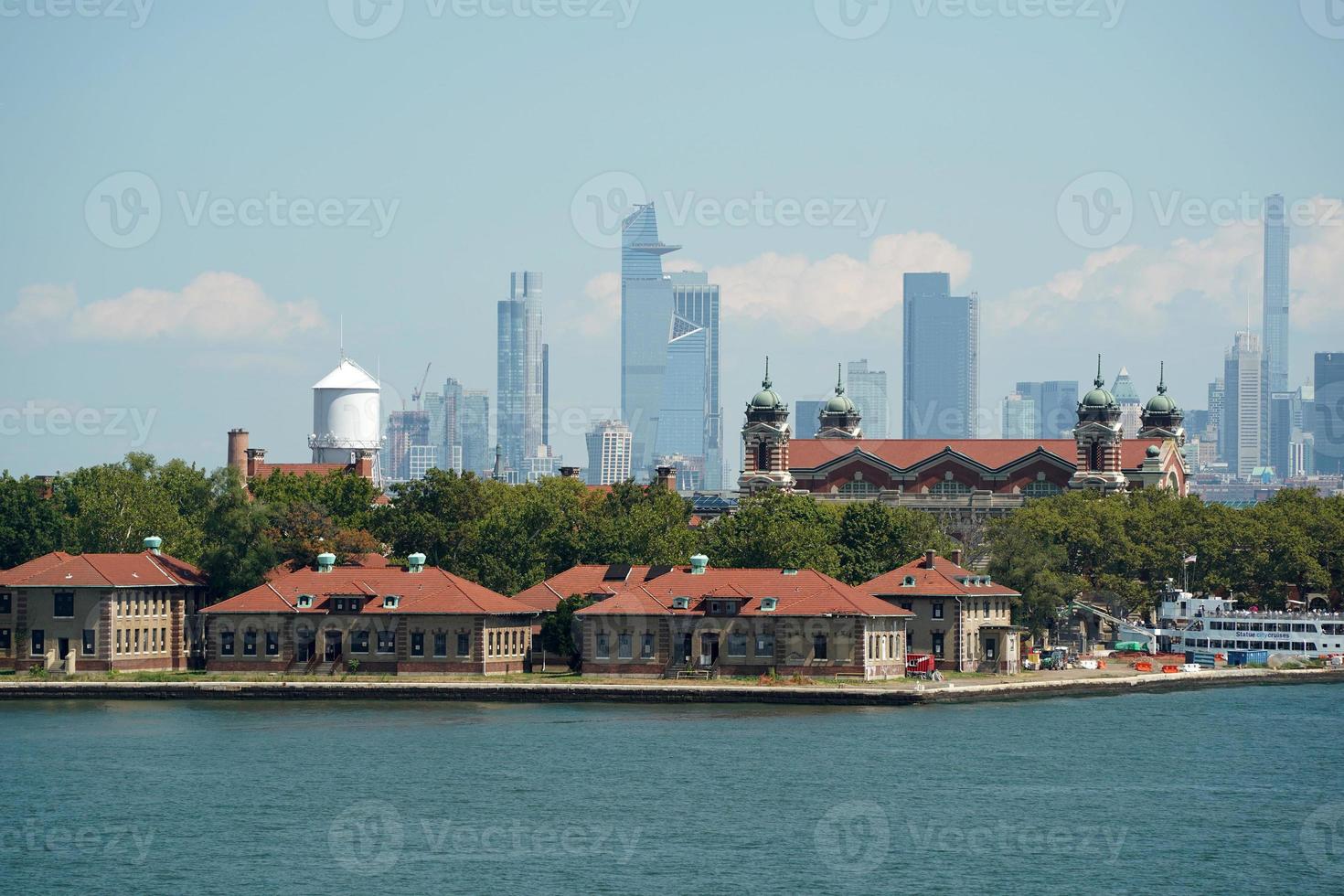 ellis island new york view cityscape from hudson river liberty island photo