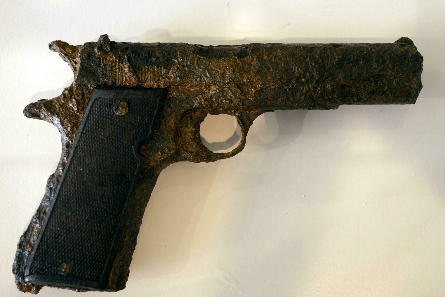 old rusted pistol being underwater for long time photo