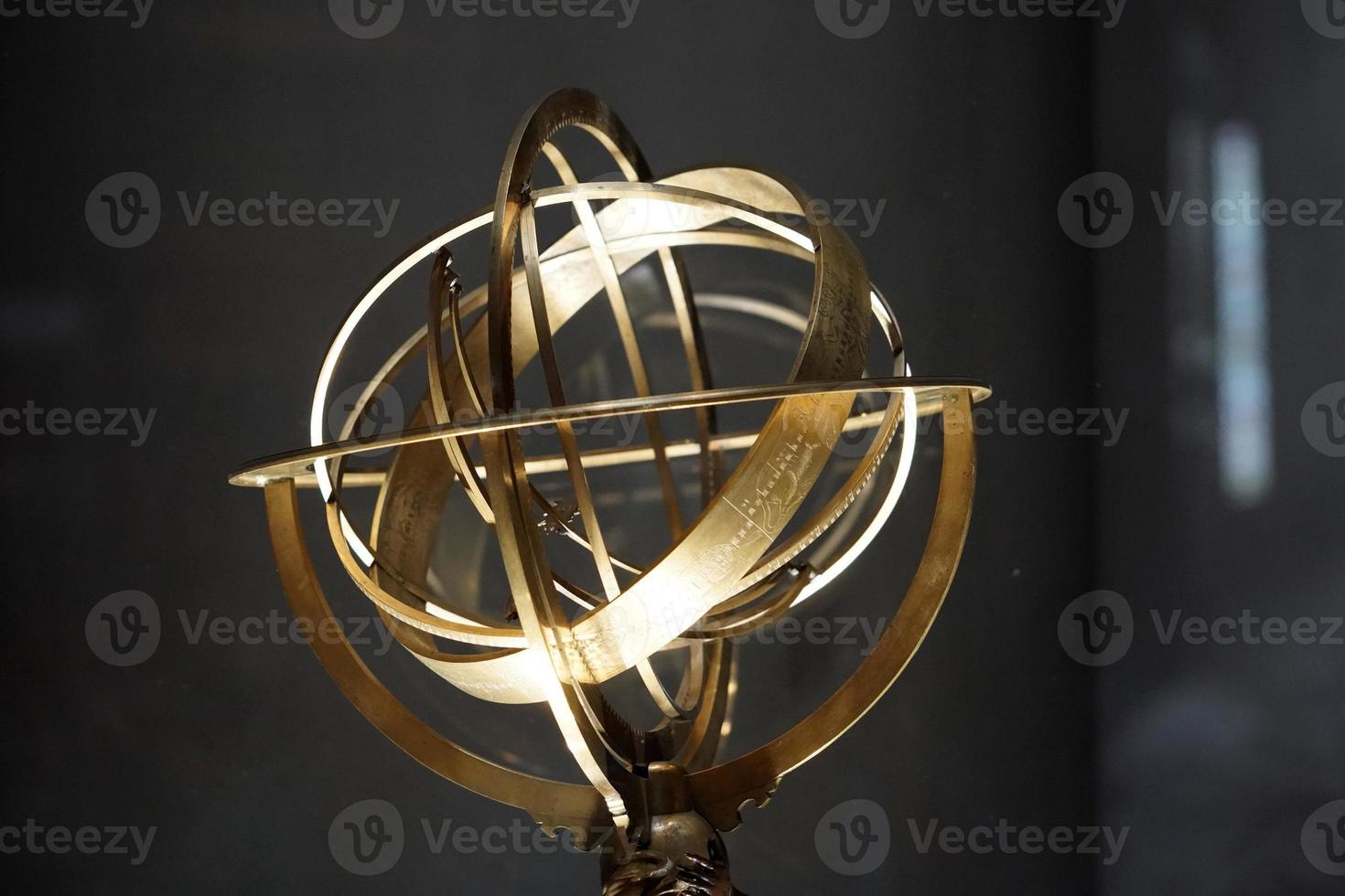 old copper astrolabe detail photo