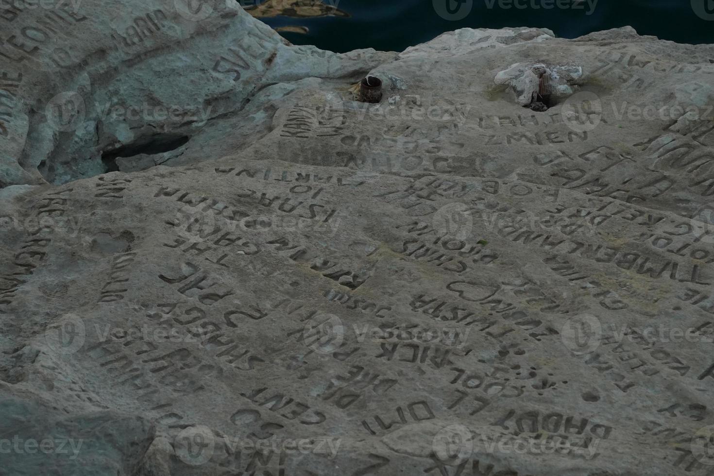 celebrity celebrities names graffiti on saint peter pools Malta rock formation photo