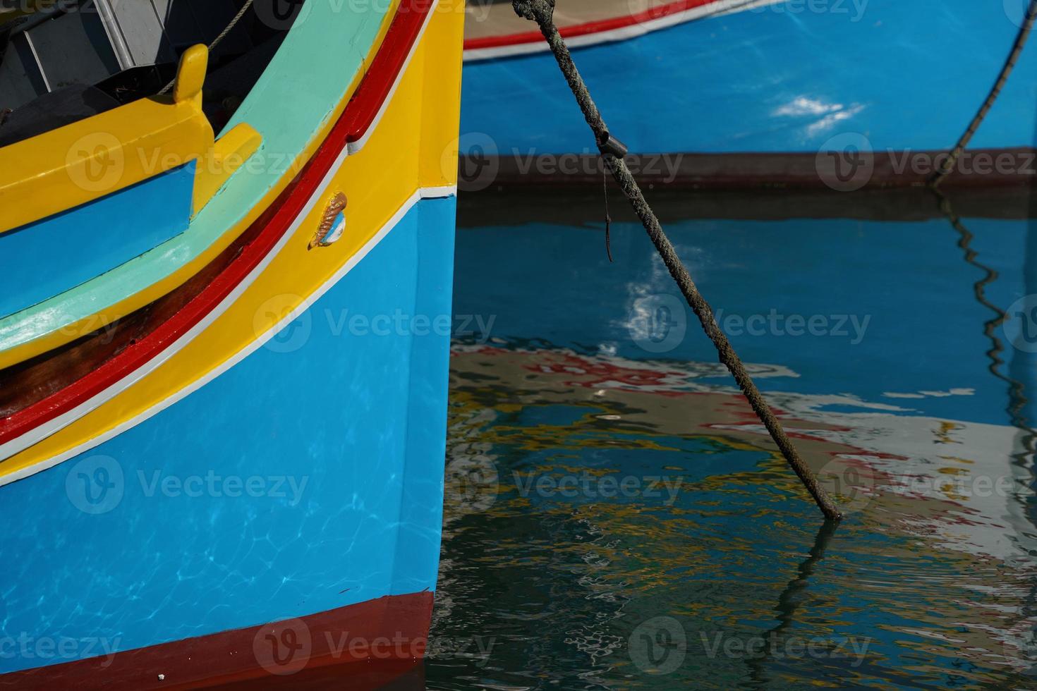 malta colorful painted fishing boat in marsaxlokk village photo