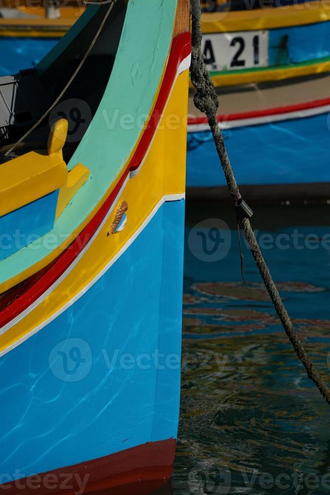 malta colorful painted fishing boat in marsaxlokk village photo