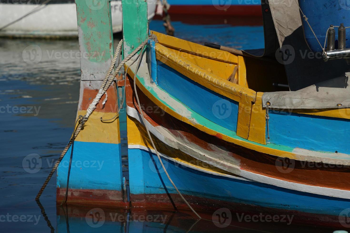 malta colorful painted fishing boat in marsaxlokk village photo