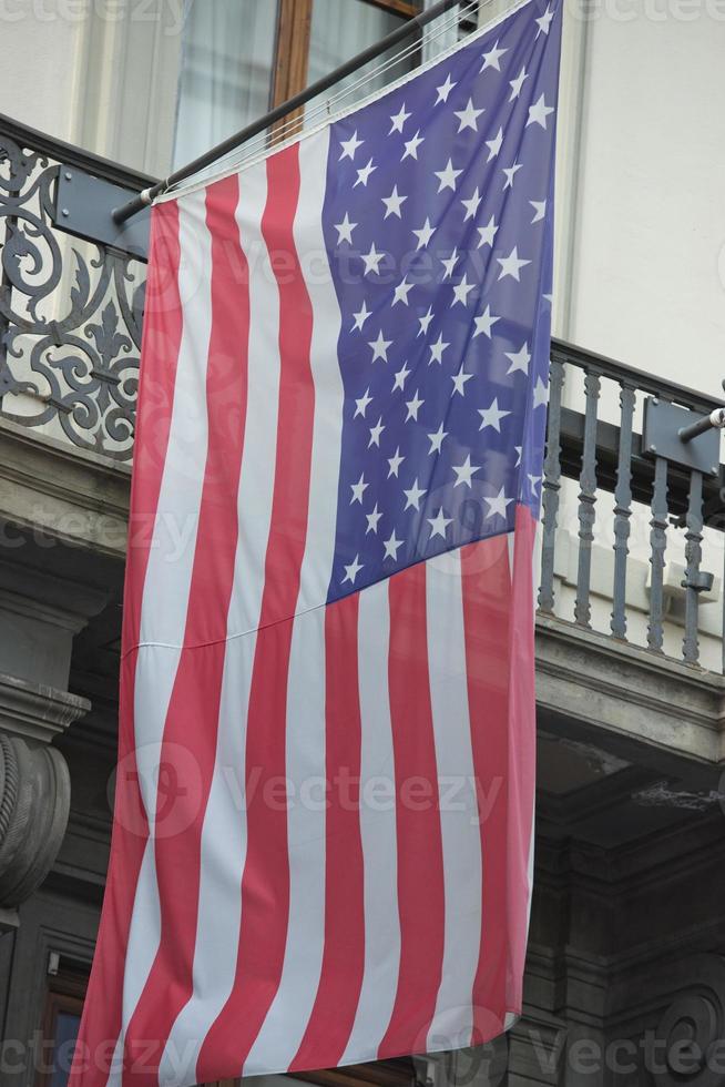 Usa American flag waving from italian balcony photo