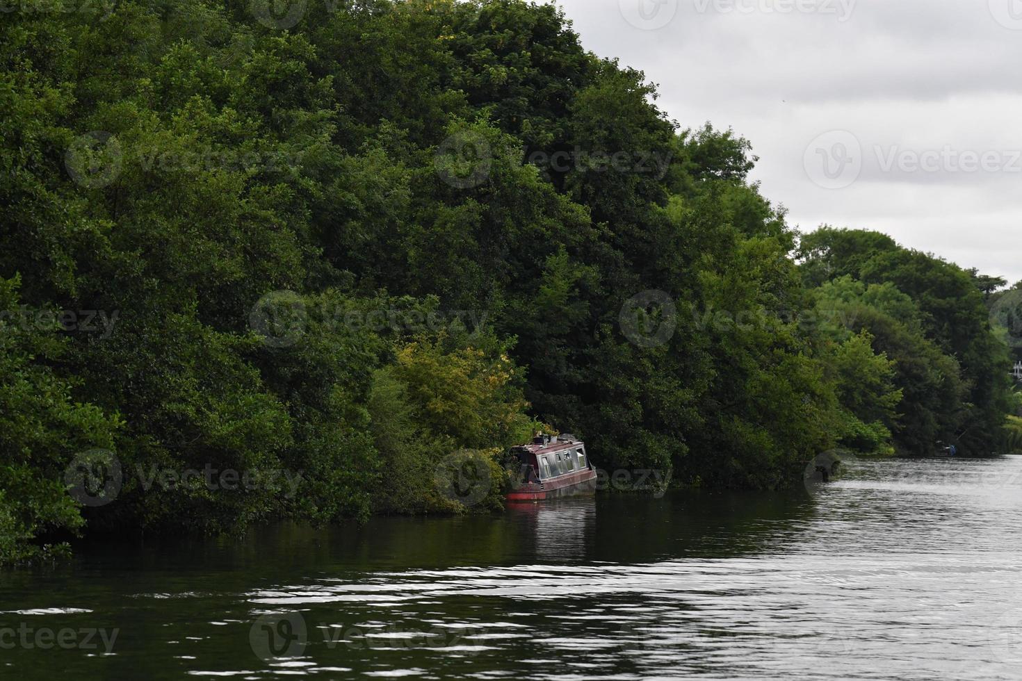 rusty rugged ship in thames river photo