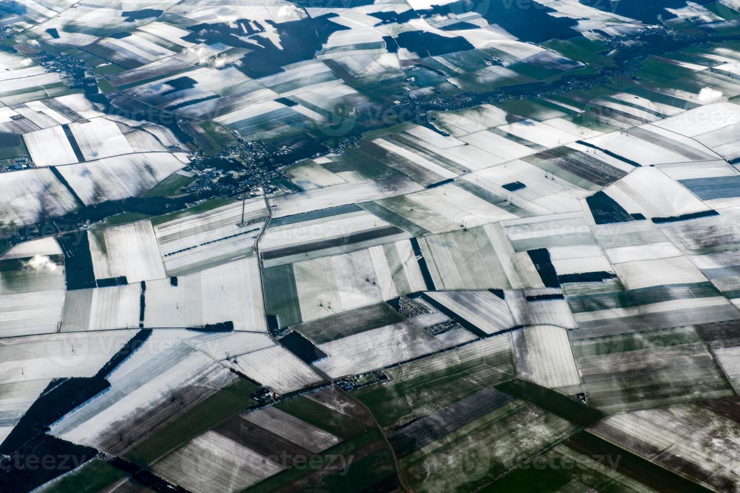 farmed fields covered by snow aerial panorama photo