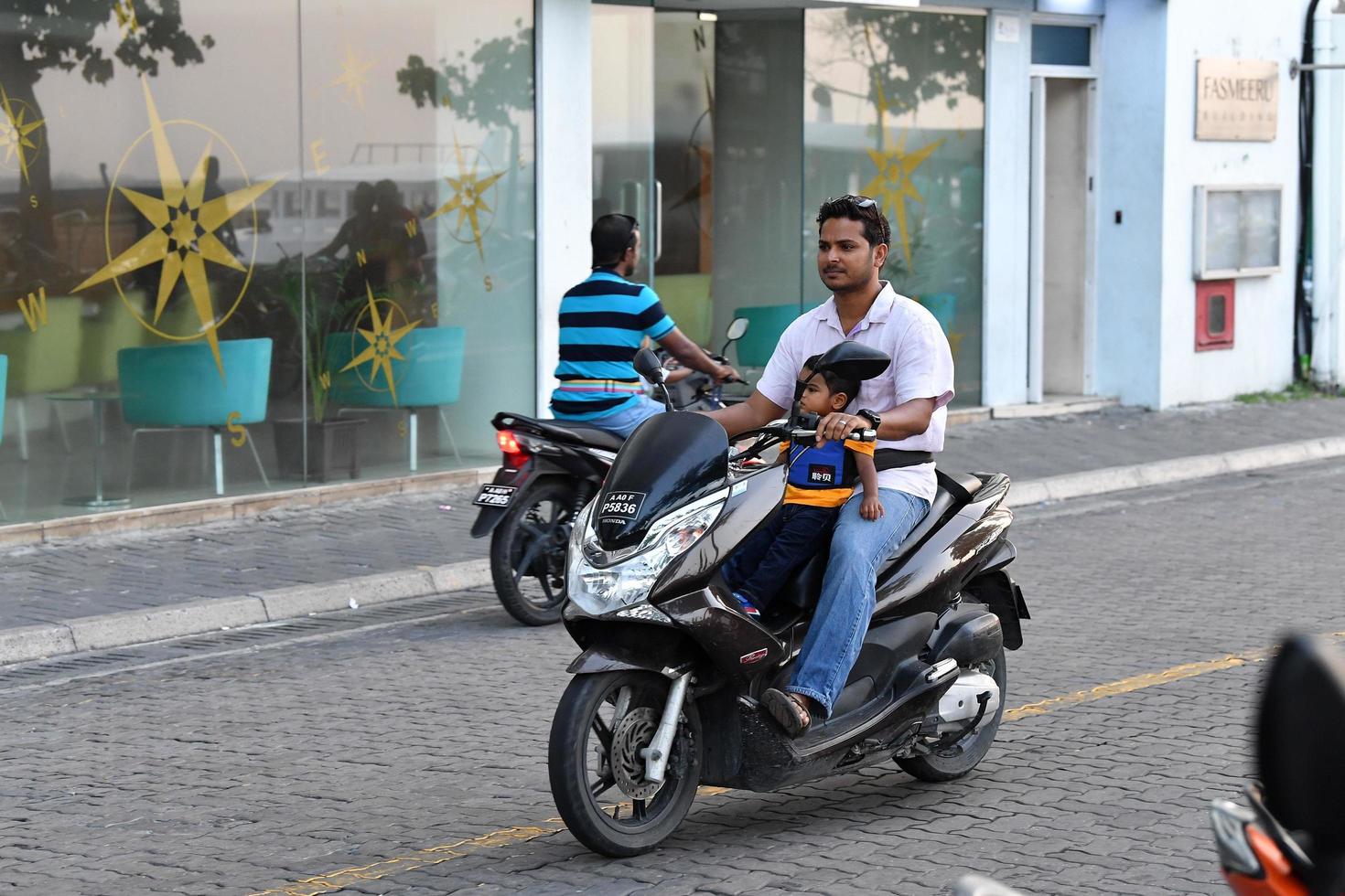 MALE, MALDIVES - FEBRUARY 17 2018 - Heavy traffic in the street before evening pray time photo