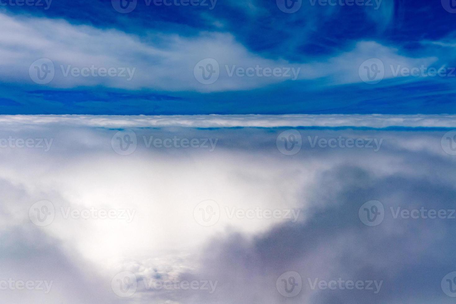 clouds in the sky from airplane window photo