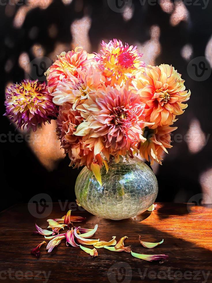 Romantic bouquet with dahlias in sun light photo