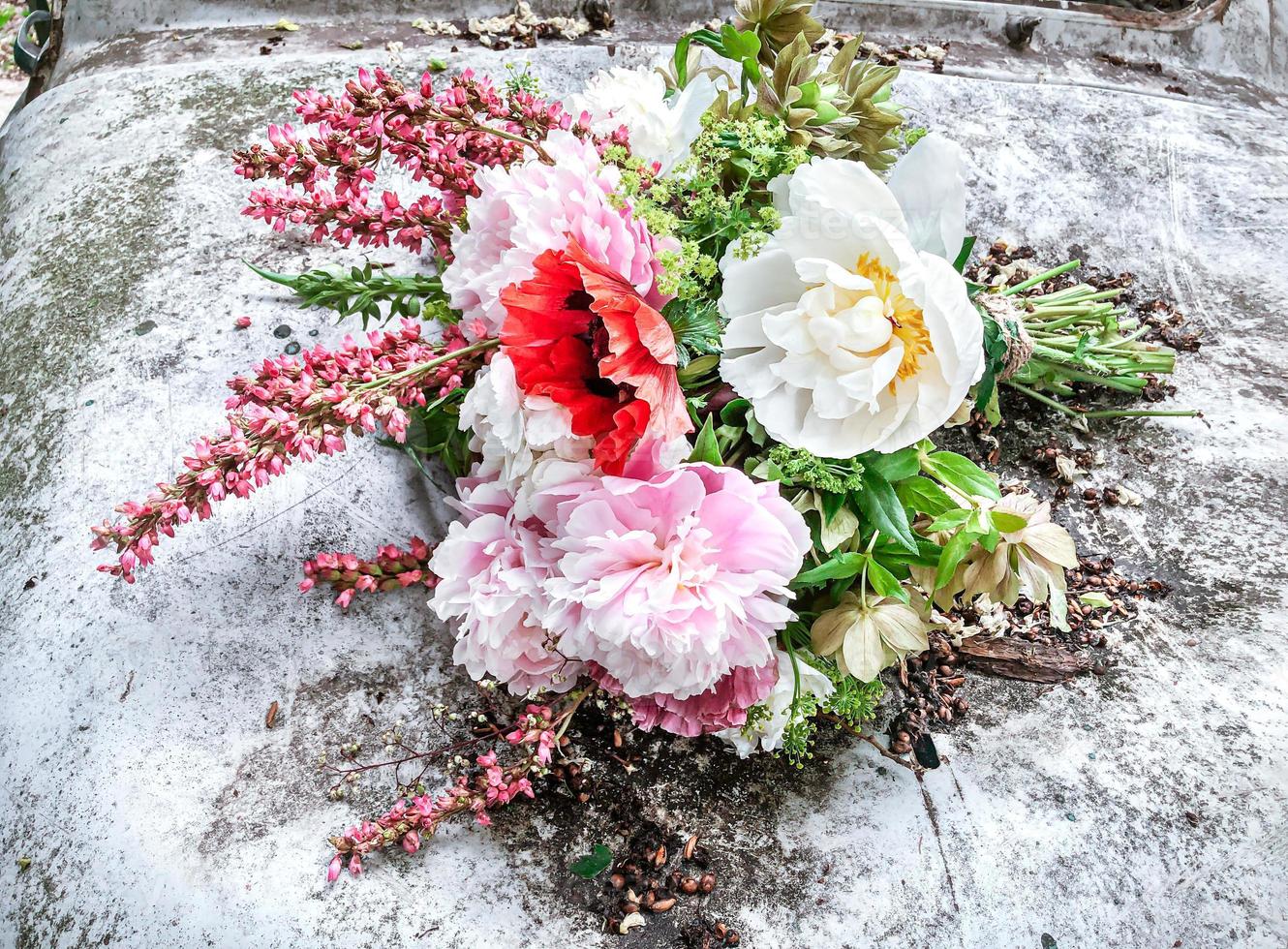 Bright romantic bouquet of spring flowers in the garden photo