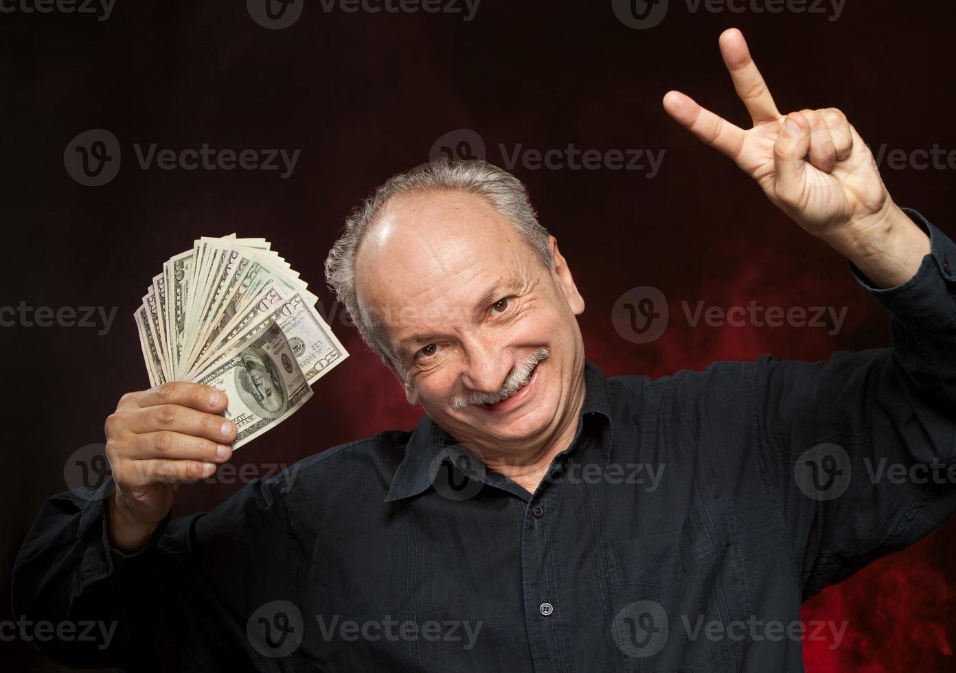 old man with dollar bills photo
