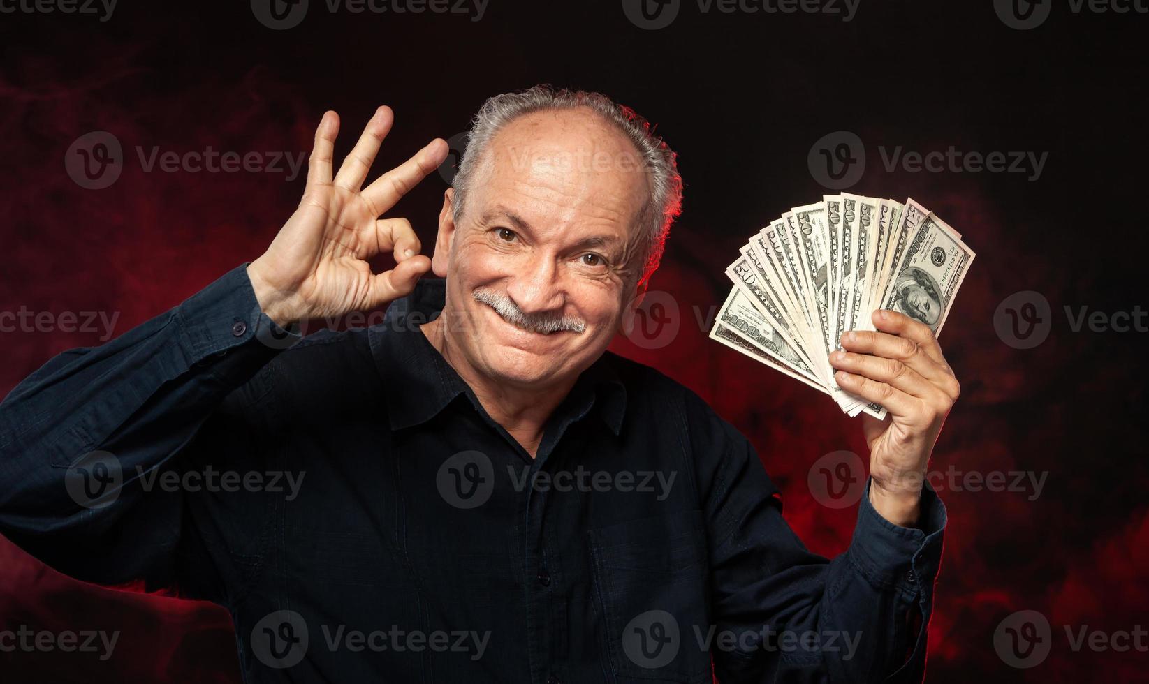 old man with dollar bills photo