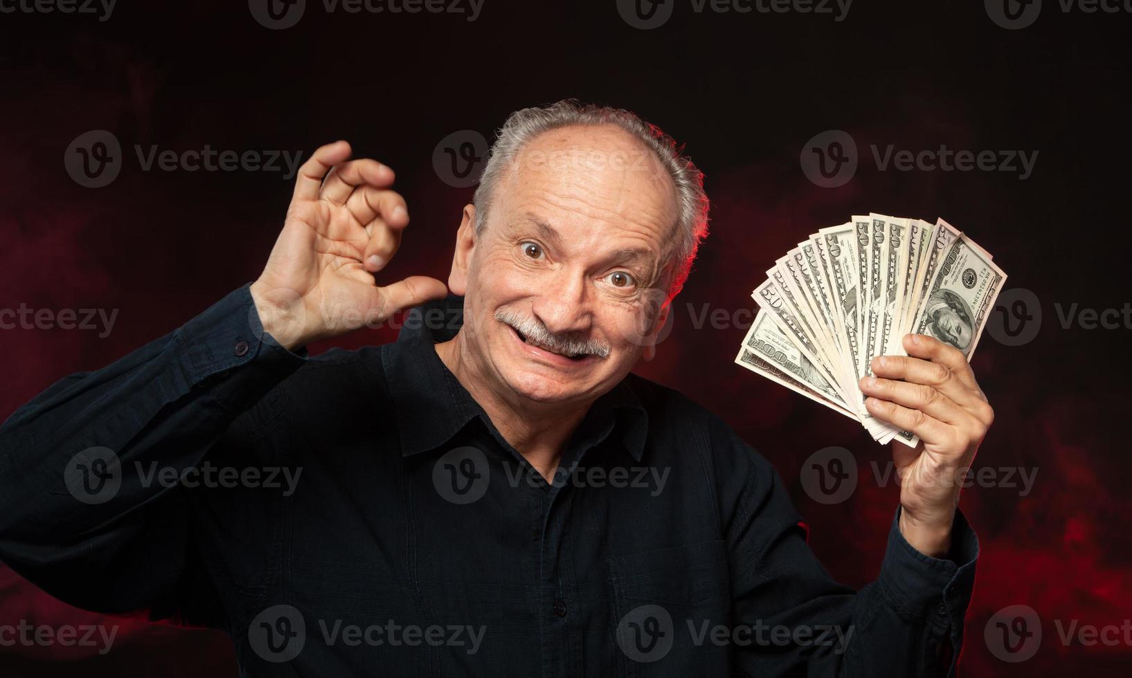 old man with dollar bills photo