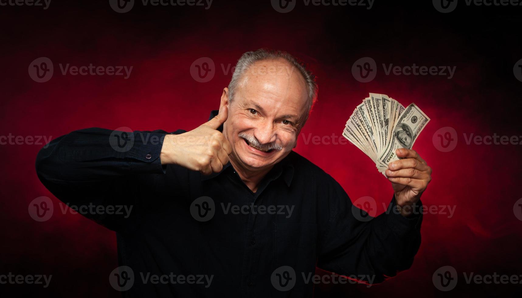 old man with dollar bills photo