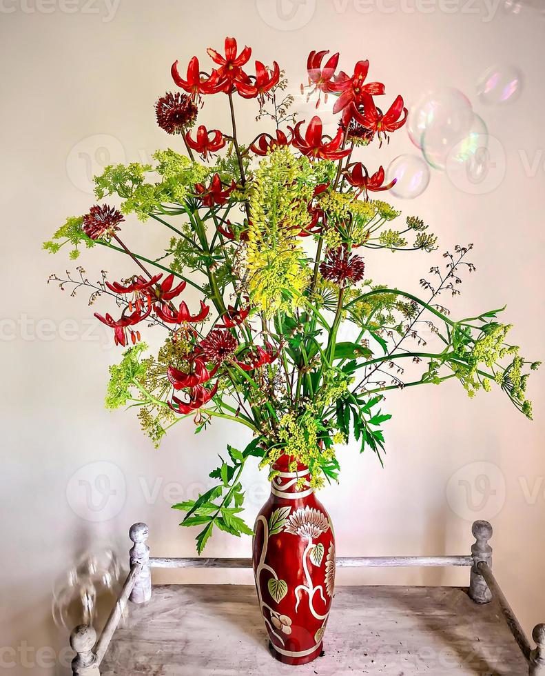 Romantic bouquet on a coffee table with soap bubbles photo