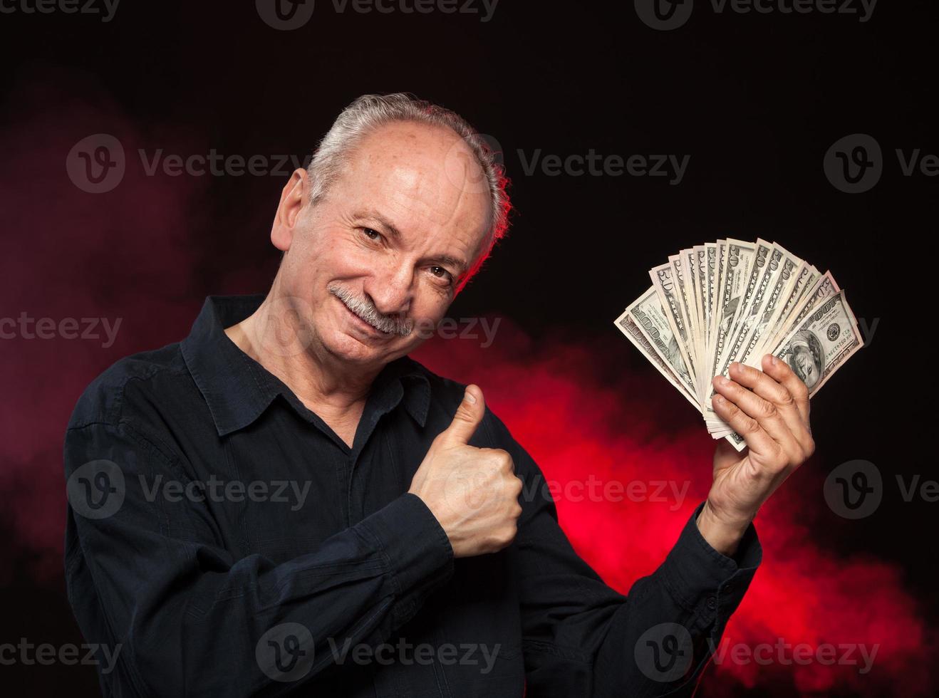 old man with dollar bills photo
